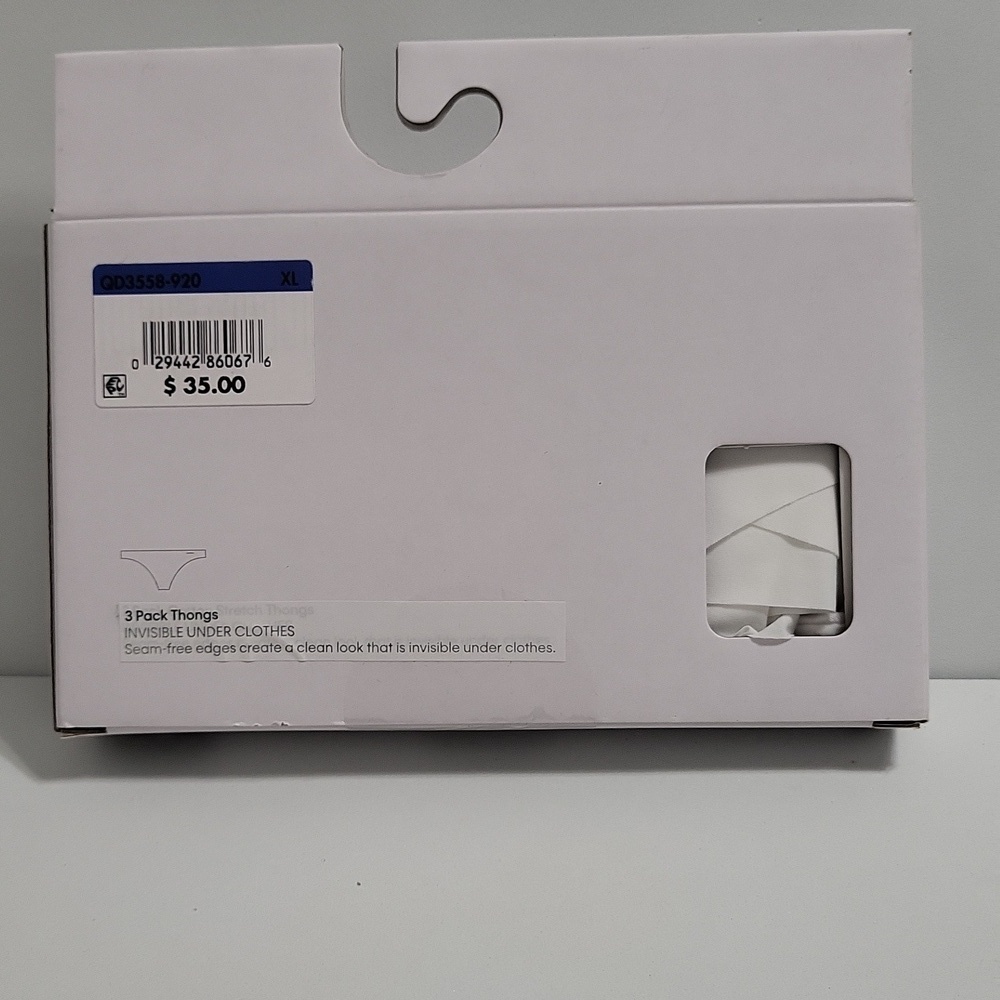 Calvin Klein Thong Trio in White, Tan, and Gray - Picture 2 of 3